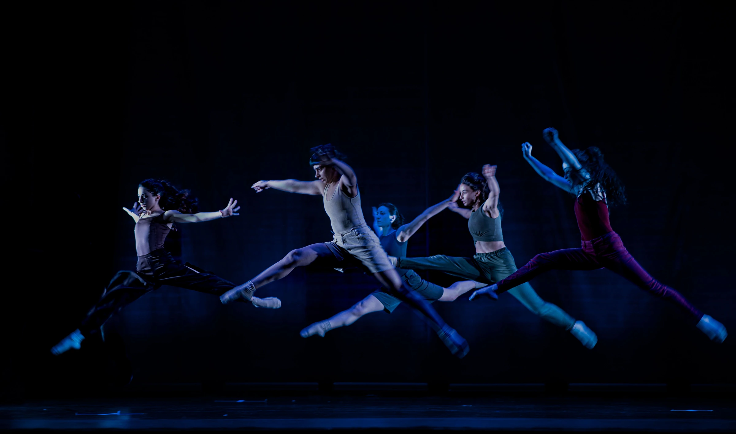 Dancers practicing together in a studio