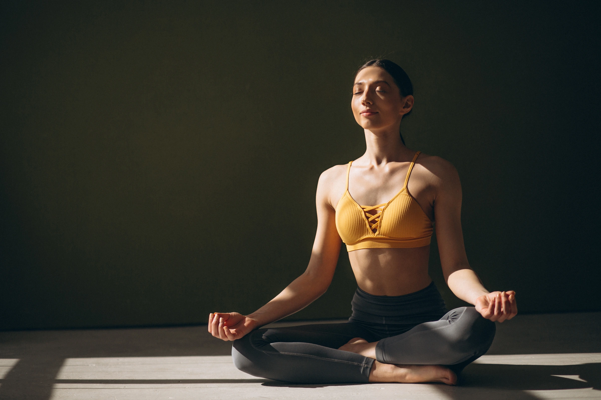 Yoga students practicing together in a studio